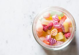 assorted-color candies on container