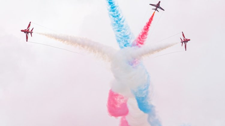 Red arrows perform a colorful aerial display.