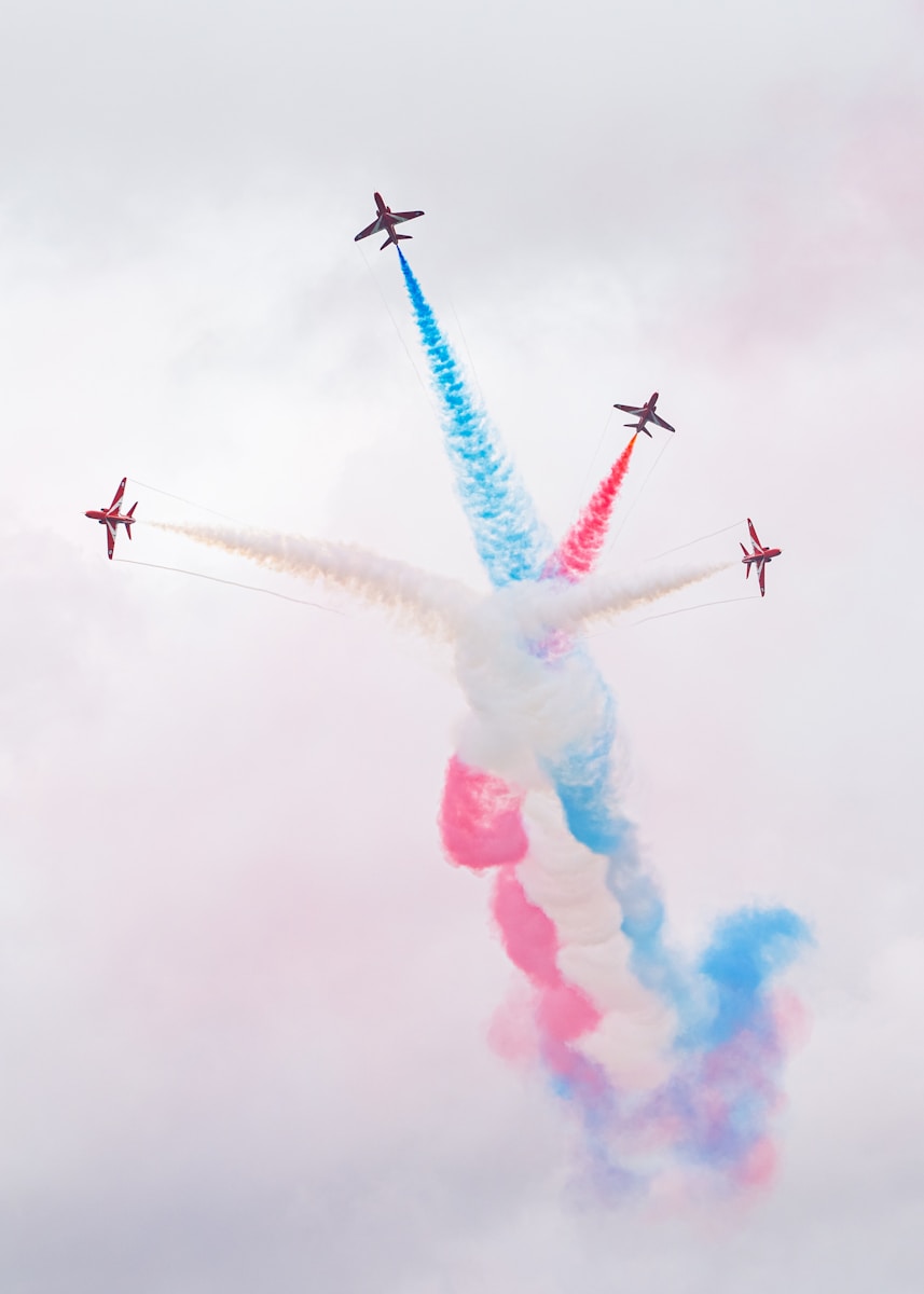 Red arrows perform a colorful aerial display.