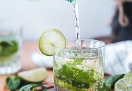 clear glass cup on brown wooden surface